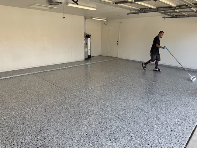 Polyaspartic topcoat being applied to garage floor — East Valley, AZ