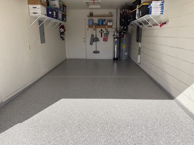 Polyaspartic garage floor coating in active garage with storage — East Valley, AZ